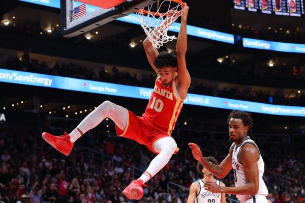Zaccharie Risacher slams home a dunk during the Nets' Game 1 loss to the Hawks.