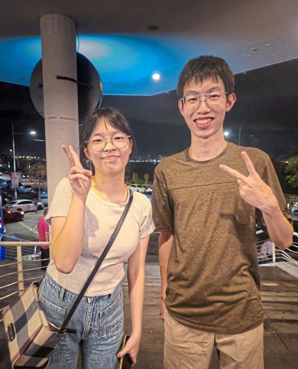 Mok (left) and Ong developed the AI Storage Sentinel, an AI-powered cabinet designed to assist dementia patients and combat food waste. — ONG CHONG YAO