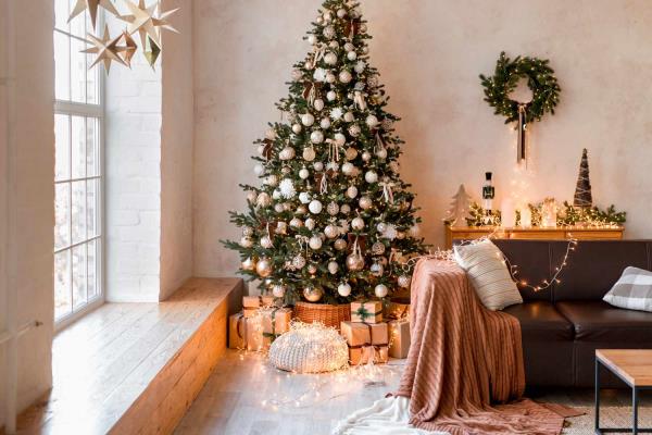 white ornaments on Christmas tree in living room