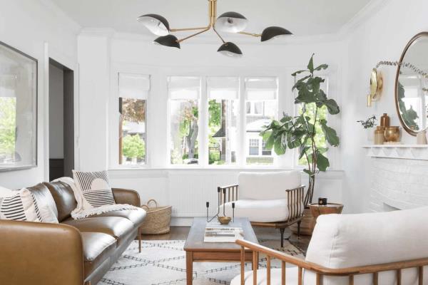 Neutral living room with black and gold ceiling light fixture