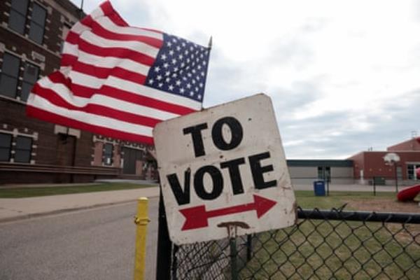 A sign to a polling booth in Dearborn, Michigan, the Detroit suburb home to the largest Arab American community in the country