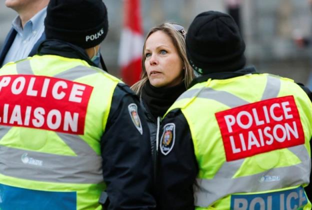 Tamara Lich, an organizer of Ottawa's protest, speaks with police liaison officers Feb. 10, 2022.