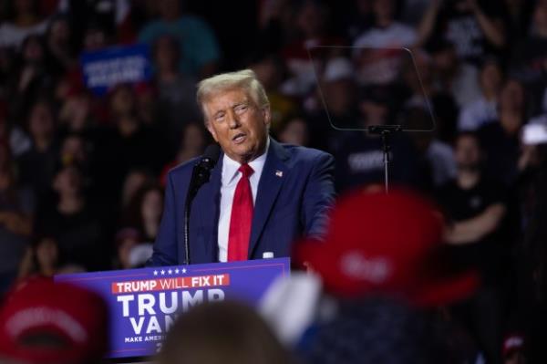 Republican presidential nominee former President Do<em></em>nald Trump speaks at a rally during the early-morning hours of election day on November 5, 2024 in Grand Rapids, Michigan. (Photo by Scott Olson/Getty Images)