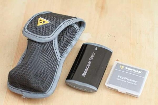 A set of chain and tyre puncture repair tools.