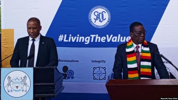 Botswana President Duma Gideon Boko, left, and Zimbabwe President Emmerson Mnangagwa make an address outside SADC offices in Gabarone, Botswana, Dec. 13, 2024.