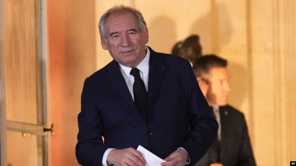 Newly named Prime Minister Fran?ois Bayrou stands after the handover at the prime minister residence, Dec. 13, 2024 in Paris. 