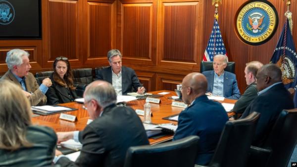 FILE - In this image provided by the White House, President Joe Biden, along with members of his natio<em></em>nal security team, receive an update in the Situation Room of the White House, April 13, 2024. 