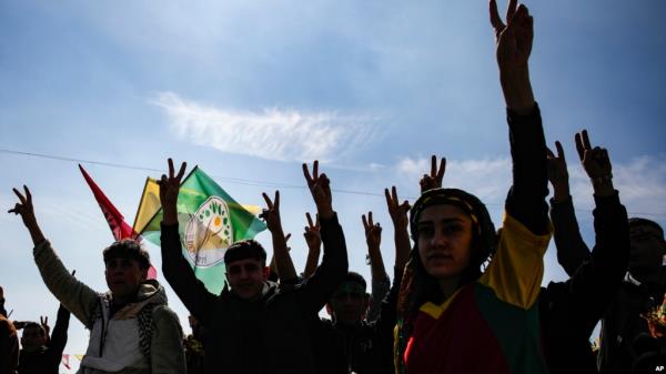 FILE - Supporters of pro-Kurdish Peoples' Equality and Democracy Party (DEM Party) chant slogans during the Newroz celebrations, in Istanbul, Turkey, on March 17, 2024. 