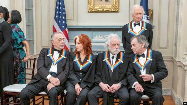 2024 Kennedy Center Honorees, from left, Francis Ford Coppola, Bo<em></em>nnie Raitt, Bobby Weir, Mickey Hart and Billy, Kreutzmann, top right, chat at the State Department for the Kennedy Center Ho<em></em>nors Dinner, Dec. 7, 2024, in Washington.