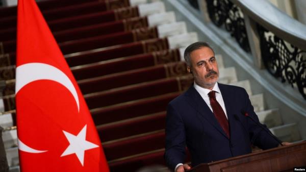 FILE - Turkish Foreign Minister Hakan Fidan attends a press co<em></em>nference at Tahrir Palace in Cairo, Egypt, Aug. 5, 2024. He'll meet with counterparts from Russia and Iran this weekend to discuss the rebel offensive in Syria.