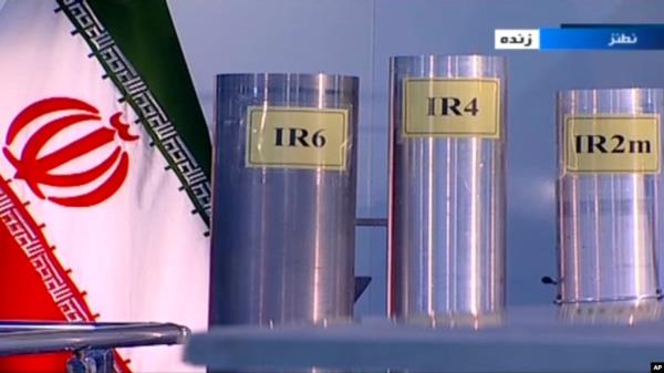 FILE - In this June 6, 2018, image taken from video on Islamic Republic Iran Broadcasting state-run TV, three versions of centrifuges are shown in a live TV program from Natanz, an Iranian uranium enrichment plant.