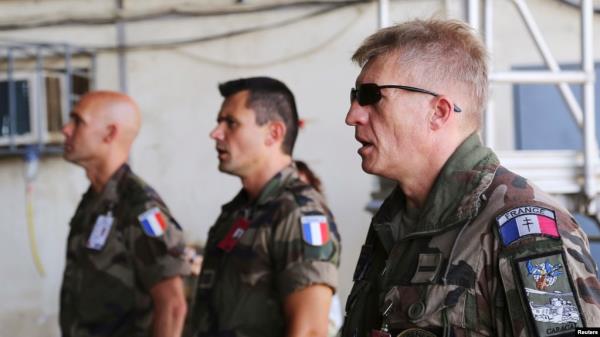 Airmen sing the French natio<em></em>nal anthem at their military ba<em></em>se N'Djamena, Chad, Oct. 26, 2014. Chad's government said Nov. 28, 2024, that it had ended its defense cooperation pact with France.