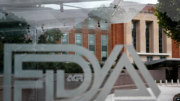 FILE - A U.S. Food and Drug Administration building is seen behind FDA logos at a bus stop on the agency's campus in Silver Spring, Maryland, on Aug. 2, 2018. The FDA announced on Nov. 28, 2024, a recall on cucumbers.