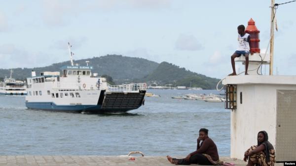 FILE - A boat arrives at the island of Mayotte in the Indian Ocean, March 31, 2012. At least 22 Somali citizens died when two boats sailing from Somalia to the French territory of Mayotte capsized.