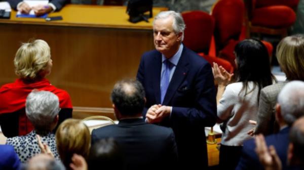 French Prime Minister Michel Barnier is applauded by members of the French government after he delivered a speech during a debate on two motions of no-co<em></em>nfidence against the French government at the Natio<em></em>nal Assembly in Paris, France, December 4, 2024. REUTERS/Sarah Meysso<em></em>nnier 