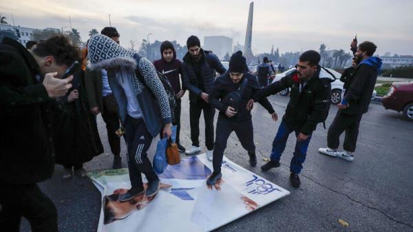 Syrian opposition fighters celebrate after the Syrian government collapsed in Damascus, Syria, Sunday, Dec. 8, 2024. Picture: AP Photo/Omar Sanadiki