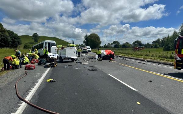 One person is dead and 14 others are injured after a small bus loaded with internatio<em></em>nal tourists collided with two vehicles on a straight stretch of State Highway 1.