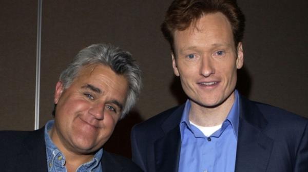 Jay Leno smiling with Co<em></em>nan O'Brien