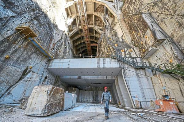 A quarryman walks at the entrance of the Candoglia Quarry of marble.