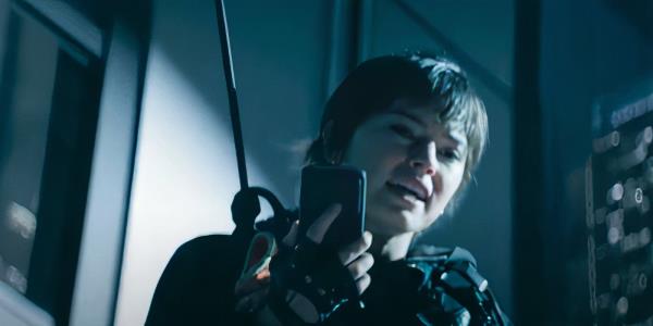 Cleaner Daisy Ridley talking on speaker phone