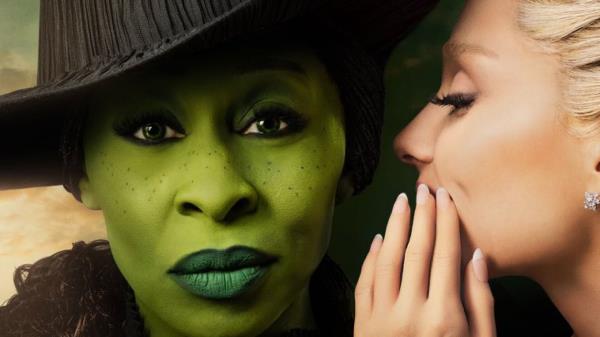 Ariana Grande as Galinda whispering into the ear of Cynthia Erivo as Elphaba Thropp in the 2024 movie Wicked