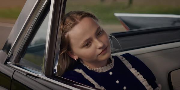 Annie sitting in the backseat of her car in The Man in the White Van