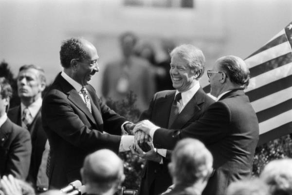 From left: President Anwar el-Sadat of Egypt, President Jimmy Carter and Prime Minister Menachem Begin of Israel in a three-way handshake after the signing of the peace treaty between Egypt and Israel at the White House in 1979. 