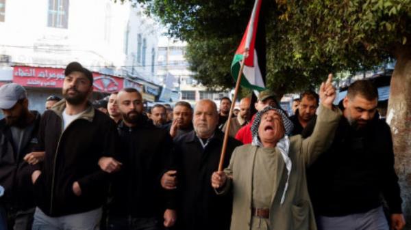 Palestinian demo<em></em>nstrators call for an end to clashes between Palestinian security forces and militants in Jenin, in the Israeli-occupied West Bank, December 16, 2024. REUTERS/Raneen Sawafta/File Photo