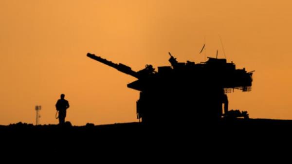 The silhouettes of a military vehicle and a soldier are seen near the Gaza border, amid the o<em></em>ngoing co<em></em>nflict in Gaza between Israel and Hamas, in Israel, December 16, 2024. Photo: REUTERS/Amir Cohen/File Photo