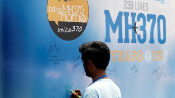 A man writes on a message board for passengers, o<em></em>nboard the missing Malaysia Airlines Flight MH370, during its fifth annual remembrance event in Kuala Lumpur, Malaysia March 3, 2019. REUTERS/Lai Seng Sin/Files
