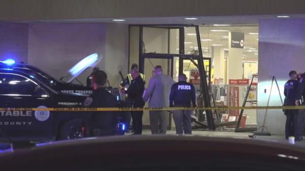 Five hurt as truck being chased by police driven through department store