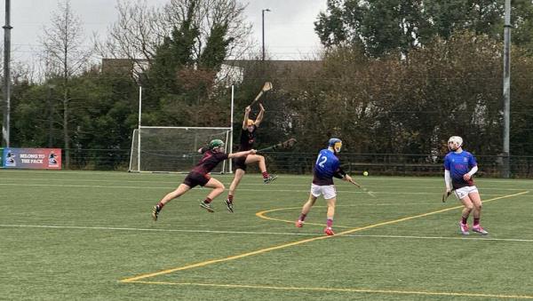 St Munchin's Ciaran Howard gets his shot off as Roscrea's Dara Phelan goes for the block. 