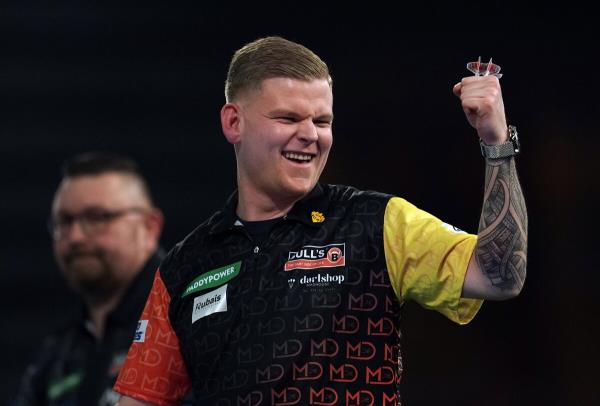 Mike De Decker celebrates his win over Dragutin Horvat (not pictured) on day five of the Paddy Power World Darts Champio<em></em>nship at Alexandra Palace, London. Picture date: Tuesday December 19, 2023.