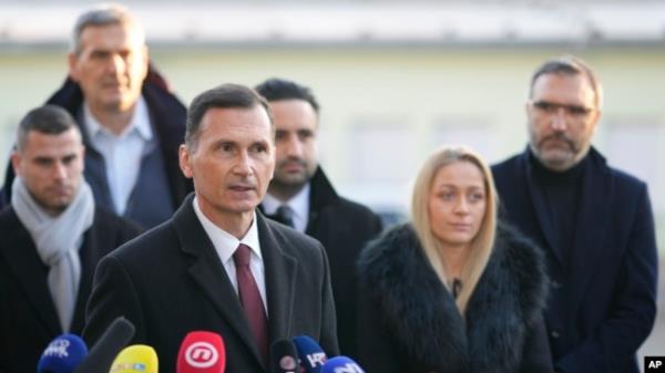 Dragan Primorac, the candidate of the ruling Croatian Democratic Unio<em></em>n (HDZ) speaks to the media after casting his ballot during a presidential election at a polling station in Zagreb, Dec. 29, 2024.