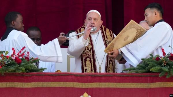 Pope Francis delivers the Urbi et Orbi (Latin for 'to the city and to the world' ) Christmas' day blessing from the main balcony of St. Peter's Basilica at the Vatican, Dec. 25, 2024. 