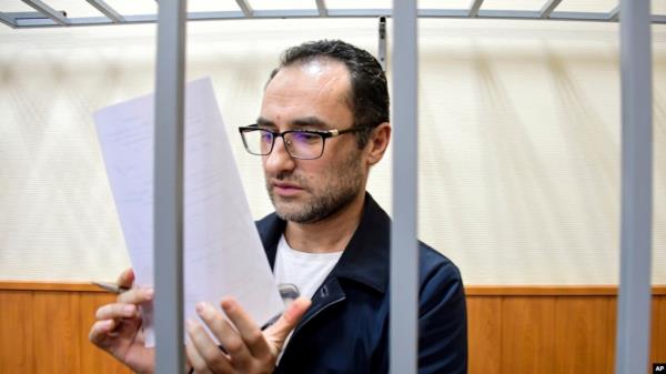 FILE - Eugene Spector, Russian-born U.S. citizen already impriso<em></em>ned in Russia on a bribery stands behind bars in a courtroom in Moscow, Russia, Feb. 20, 2020. Spector has been handed a second 15-year jail term for espionage, Russian news agencies reported on Dec. 24, 2024.
