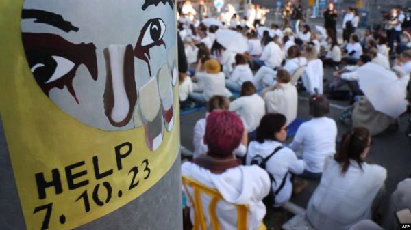 Relatives and supporters of Israelis held hostage in Gaza attend a sit-in demanding an immediate agreement for the return of all abductees on the hostage square in front of the Israeli Defense Ministry in Tel Aviv, on Dec. 25, 2024.