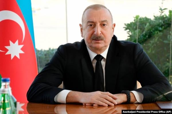 In this photo provided by Azerbaijan's Presidential Press Office, Azerbaijani President Ilham Aliyev holds a meeting in Baku, Dec. 25, 2024 following an Azerbaijan Airlines Embraer 190 plane crash.