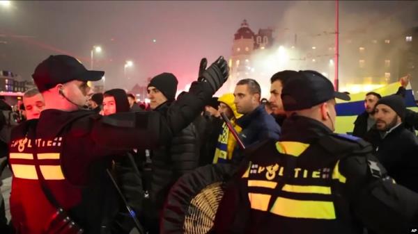 FILE - In this image taken from video, police escort Maccabi Tel Aviv fans to a metro station leading them to Ajax stadium, after pro-Palestinian fans marched near the stadium, in Amsterdam, Netherlands, Nov. 7, 2024. 