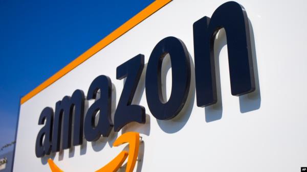 FILE - In this April 16, 2020, photo, the Amazon logo is seen in Douai, northern France. 