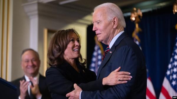 U.S. Vice President Kamala Harris embraces U.S. President Joe Biden prior to speaking during the Democratic Natio<em></em>nal Committee's Holiday Reception in Washington, D.C., Dec. 15, 2024.