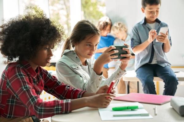 Kids in a classroom on smartphones