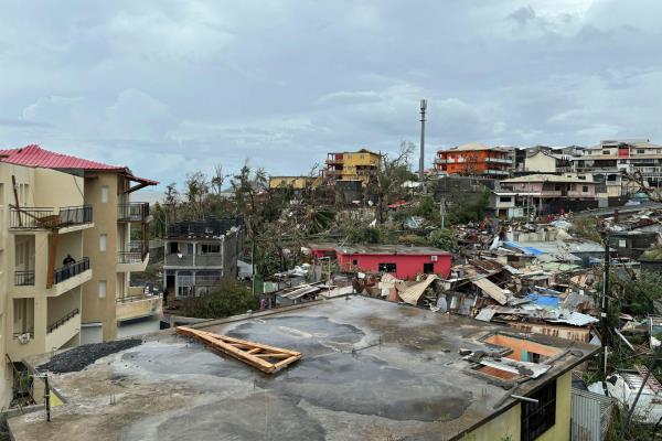 view of damaged buildings, lots of debris across  Mayotte after cyclone hit