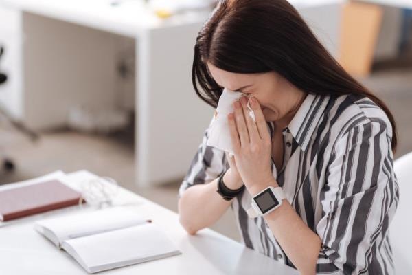 Sick woman at work