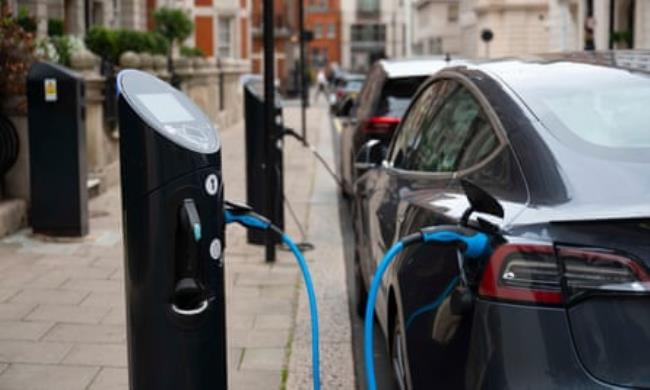 An electric car being charged at a charging point in London