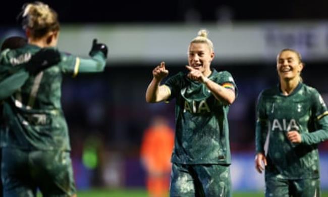 Bethany England celebrates a goal with her teammates