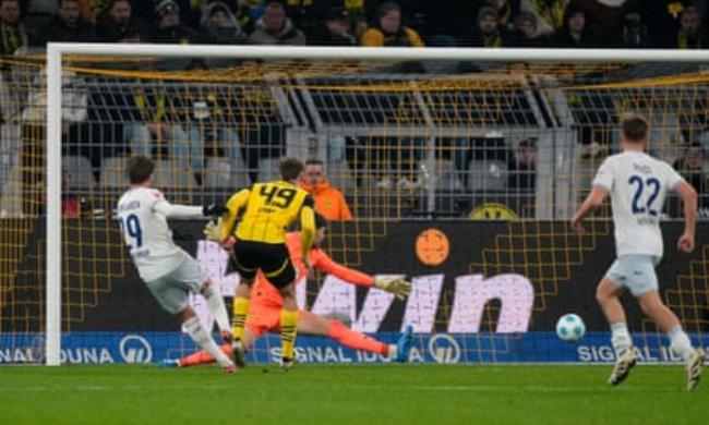 Hoffenheim’s Jacob Bruun Larsen (left) equalises against late on against Borussia Dortmund