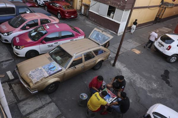 Residents play poleana in a neighbourhood in Mexico City. Photo: AP