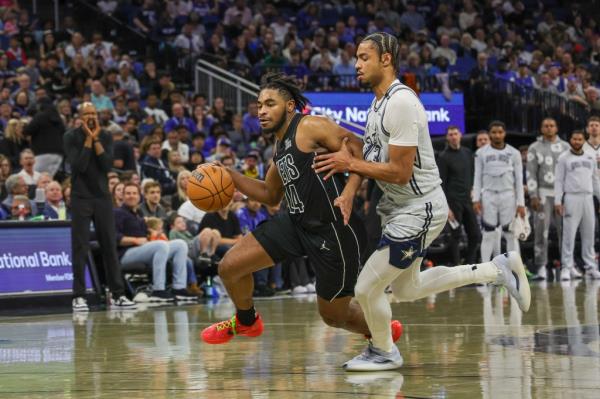 Nets guard Cam Thomas (24) drives to the basket against Orlando Magic guard Jett Howard (13) during the second quarter at Kia Center. 