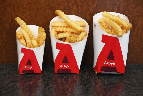 Three sizes of crinkle cut french fries - small, medium and large, at Arby's restaurant in Queens, New York